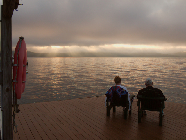 Guests enjoying the main dock while sun breaks through clouds