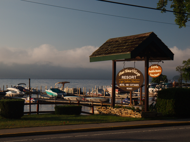 Light hitting beachside resort sign