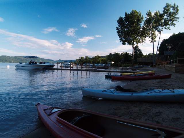 Shadowed beach and kayaks
